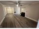 Spacious living room features modern ceiling fan and fireplace at 102 Sue Ave, Dunn, NC 28334