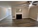 Spacious living room features modern ceiling fan and fireplace at 102 Sue Ave, Dunn, NC 28334