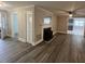 Spacious living room features modern ceiling fan and fireplace at 102 Sue Ave, Dunn, NC 28334