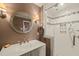 Bathroom featuring a glass-enclosed shower, a modern sink, and updated fixtures at 11424 Horsemans Trl, Raleigh, NC 27613