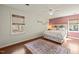 Bright bedroom with large window, bed with storage and stylish rug at 11424 Horsemans Trl, Raleigh, NC 27613