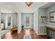 Bright foyer with hardwood floors and elegant lighting fixture at 11424 Horsemans Trl, Raleigh, NC 27613