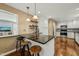 Modern kitchen with an island bar and wooden stools and stainless steel appliances at 11424 Horsemans Trl, Raleigh, NC 27613
