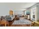 Comfortable living room with stylish rug and neutral paint at 11424 Horsemans Trl, Raleigh, NC 27613