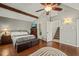 Main bedroom with exposed beams, ensuite bath and staircase to upper level at 11424 Horsemans Trl, Raleigh, NC 27613