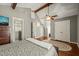 Spacious main bedroom with ensuite bath, vaulted ceilings, and exposed beams at 11424 Horsemans Trl, Raleigh, NC 27613