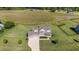 Expansive aerial view of a traditional home with well-maintained landscaping and a large yard at 124 Brookstone Way, Angier, NC 27501