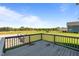 View from the deck overlooking the yard, firepit, and other neighborhood homes at 124 Brookstone Way, Angier, NC 27501