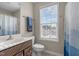 Bathroom with a window and modern fixtures at 124 Brookstone Way, Angier, NC 27501