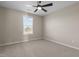 Bedroom featuring neutral walls, carpeted flooring, ceiling fan and natural light from a window at 124 Brookstone Way, Angier, NC 27501
