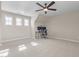 Large bonus room featuring neutral walls, carpet and multiple windows for natural light at 124 Brookstone Way, Angier, NC 27501