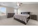 Spacious bedroom featuring a vaulted ceiling, neutral color palette, and a large window for natural light at 124 Brookstone Way, Angier, NC 27501