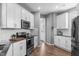 Modern kitchen with white cabinets, subway tile backsplash, and stainless appliances at 124 Brookstone Way, Angier, NC 27501
