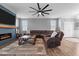 Inviting living area with stylish furniture, a large ceiling fan, and neutral wall colors at 124 Brookstone Way, Angier, NC 27501