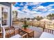 Relaxing back deck with wood furniture, offering stunning views of the surrounding neighborhood and lush greenery at 124 Ferrell W Rd, Apex, NC 27523