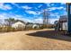Expansive backyard view of neighboring homes and a home featuring a deck with stairs at 124 Ferrell W Rd, Apex, NC 27523