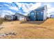 Spacious backyard showcasing multiple homes with deck, and a vast lawn, ready for landscaping at 124 Ferrell W Rd, Apex, NC 27523