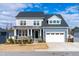 Charming two-story home with a two-car garage and craftsman-style details at 124 Ferrell W Rd, Apex, NC 27523