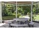 Charming outdoor gazebo featuring a picnic table in an open space, with lush greenery creating a serene backdrop at 124 Ferrell W Rd, Apex, NC 27523