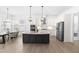 Beautiful kitchen with stainless steel appliances, island, granite countertops, and eat-in dining area at 124 Ferrell W Rd, Apex, NC 27523