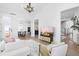Bright living room showcasing an open floor plan, leading to the kitchen and dining area at 124 Ferrell W Rd, Apex, NC 27523