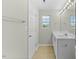 Bathroom featuring a large vanity with ample lighting and a window at 1306 Plexor Ln, Knightdale, NC 27545