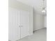 Bedroom with a ceiling fan, gray carpet and a large closet with white doors at 1306 Plexor Ln, Knightdale, NC 27545