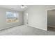 Bedroom featuring a ceiling fan, large window, and ensuite bathroom at 1306 Plexor Ln, Knightdale, NC 27545