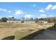 Townhome community with a large open space and residential building at 1306 Plexor Ln, Knightdale, NC 27545
