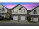 Charming townhome with brick accents, private garage, and welcoming curb appeal at 1306 Plexor Ln, Knightdale, NC 27545