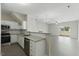 Open kitchen with stainless steel appliances, granite countertops, and wood flooring at 1306 Plexor Ln, Knightdale, NC 27545