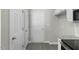 Open floor plan living room, great natural light, and wood-look floors at 1306 Plexor Ln, Knightdale, NC 27545