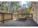Spacious wooden deck featuring a bench with decorative pillows at 14 Winchester Ct, Durham, NC 27707
