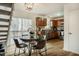 Open eat-in kitchen with wood cabinets, modern appliances, and an adjacent breakfast nook at 14 Winchester Ct, Durham, NC 27707