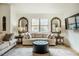 Cozy living room featuring a large sofa, stylish decor, and natural light from a large window at 14 Winchester Ct, Durham, NC 27707