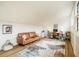 Inviting living room featuring a cozy sofa, modern rug, and stylish decor at 14 Winchester Ct, Durham, NC 27707