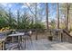 Charming back deck with outdoor seating, ideal for relaxing and entertaining overlooking the landscaped yard at 1404 Vanguard Pl, Durham, NC 27713