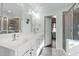 Bright bathroom with double sinks, granite countertops, and a glass-enclosed shower creates a spa-like experience at 1404 Vanguard Pl, Durham, NC 27713