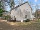 Angle of home's siding, with windows and a wooden deck, providing a detailed view of its structure and design at 1404 Vanguard Pl, Durham, NC 27713