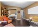 Cozy living room featuring a white piano, modern decor, and warm, inviting colors throughout at 1404 Vanguard Pl, Durham, NC 27713