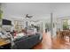 Open-concept layout showcasing the living room, kitchen, and dining area with hardwood floors and neutral colors at 1404 Vanguard Pl, Durham, NC 27713