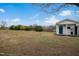 Spacious backyard with lush greenery and a charming playhouse at 1421 Harvey Johnson Rd, Raleigh, NC 27603