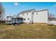 Backyard featuring a wooden deck, seating, grilling area, and a view of the home at 1421 Harvey Johnson Rd, Raleigh, NC 27603