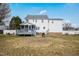 Wide view of the backyard featuring a deck, lawn, and two-story home at 1421 Harvey Johnson Rd, Raleigh, NC 27603