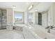 Spacious bathroom with double vanity, large mirror, and separate shower and tub at 1421 Harvey Johnson Rd, Raleigh, NC 27603