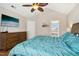 Cozy bedroom with a large bed, flat screen tv, and ensuite bathroom at 1421 Harvey Johnson Rd, Raleigh, NC 27603