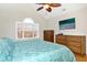 Bright bedroom with vaulted ceilings, large windows, and wood furniture at 1421 Harvey Johnson Rd, Raleigh, NC 27603