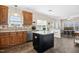 Bright and airy kitchen with wooden cabinets, a center island, and ample counter space at 1421 Harvey Johnson Rd, Raleigh, NC 27603