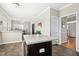 Bright kitchen with a kitchen island and views of the dining area and natural light at 1421 Harvey Johnson Rd, Raleigh, NC 27603