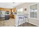 Modern kitchen featuring a breakfast bar, stainless steel appliances and natural light at 1421 Harvey Johnson Rd, Raleigh, NC 27603